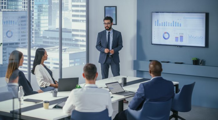 Office Conference Room Meeting: Digital Enterpreneur Presents e-Commerce Investment Strategy for Group of Investors. Boardroom Strategies for Dominating AI Investments, Risks, and Value