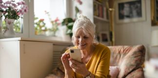 Old lady enjoying dating app using Meetheage