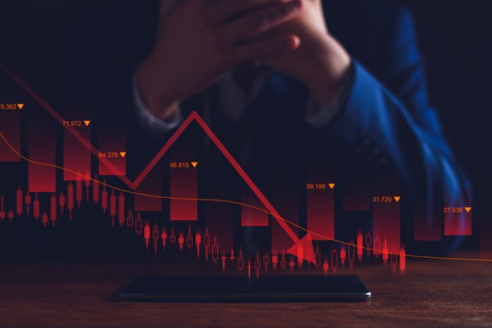 Property values are steadily declining. Unhappy businessman, business downturn. company stocks fall in value, economic crisis, global economy slows down, trading drops, high risk investments. problematic businessman after company bankruptcy