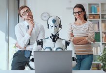 business people supervising an AI robot working in the office. Person with emotional intelligence and AI