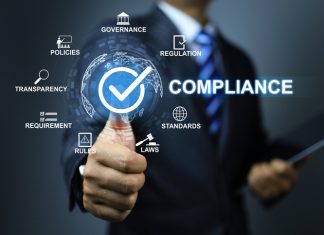 Compliance concept with businessman thumb up checkmark to applied standard and regulation for export products to foreign countries to meet government trade requirement in global business