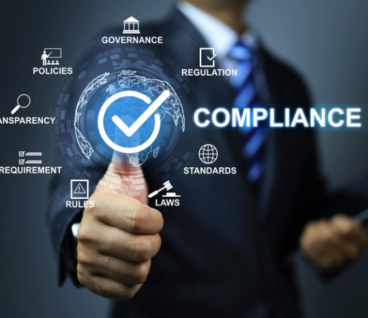 Compliance concept with businessman thumb up checkmark to applied standard and regulation for export products to foreign countries to meet government trade requirement in global business