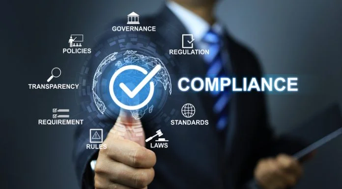 Compliance concept with businessman thumb up checkmark to applied standard and regulation for export products to foreign countries to meet government trade requirement in global business