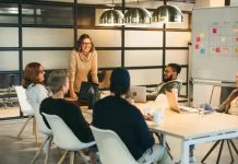 They work together as a team, brainstorming creative ideas for a successful tech company project. Guided by a confident leader, their collaboration fosters a professional and innovative workplace environment. Storytelling for Talent Retention concept.