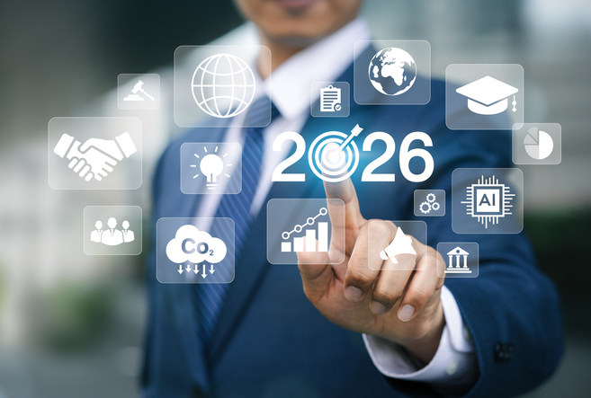 New Year 2026 Business Goals Concept. Businessman tapping 2026 goal icon on virtual screen. Goal analysis, finance, success planning strategy. Plans and visions for 2026. Business growth. Businessman sets new goals and resolutions for the future of work 2026