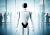 Moral Engineering: When AI Decides Where It’s Safe to Walk Moral Engineering -Futuristic humanoid robot standing in modern office with blurry businesspeople in background