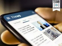 Person checking article online. Editorial Credibility concept