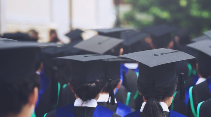 shot of graduation hats during commencement success graduates of the university, Concept education congratulation Student young the graduates in University. MBA vs. Skills-Based Learning concept