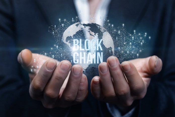 Blockchain Intelligence. Hands of businesswoman support the block chain .