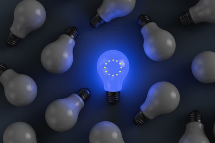 Glowing light bulb with the symbols of the European Union. Political and economic topics Europe Struggles to Turn Innovation into Disruption