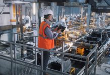 Manufacturing Plants - worker controlling production line