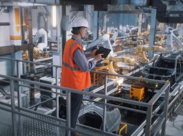 Manufacturing Plants - worker controlling production line