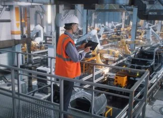 Manufacturing Plants - worker controlling production line