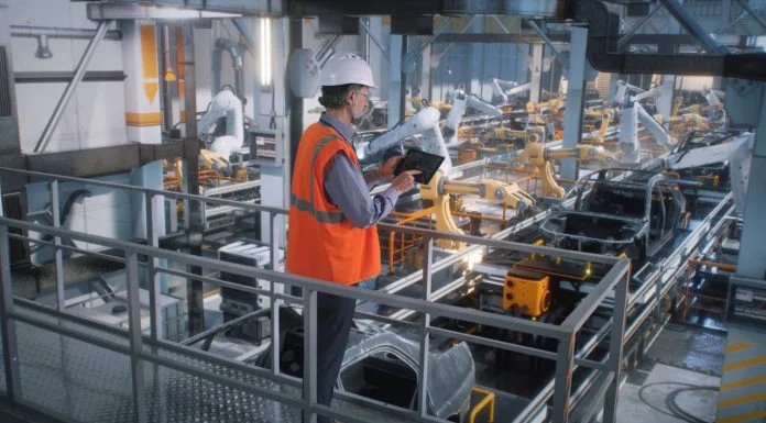 Manufacturing Plants - worker controlling production line