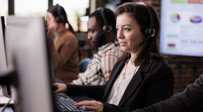 Sales assistant being employed at customer care support job, working on telemarketing call center at helpdesk. Female receptionist with helpline service helping clients on remote communication.