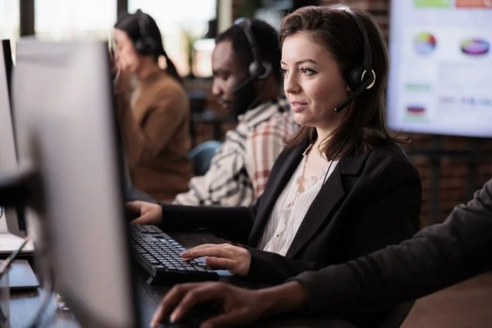 Sales assistant being employed at customer care support job, working on telemarketing call center at helpdesk. Female receptionist with helpline service helping clients on remote communication.