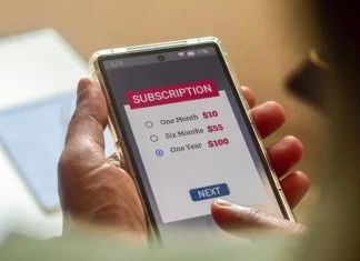 Consumer Behaviour in the Digital Age. Man choosing a subscription plan for one year using mobile applications