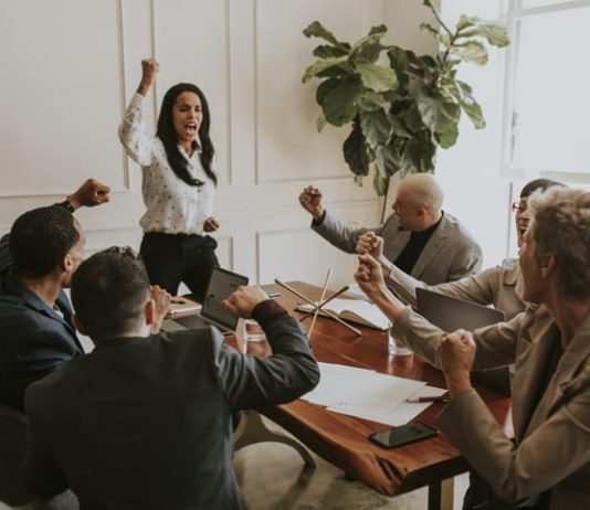 How to Lead With M.A.G.I.C.: The Framework Redefining Confidence, Clarity and Culture Businesswoman motivating her team members and leading the team with confidence