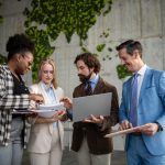 Diverse business team collaborating on global strategy. EU Inc. & Scaling cross-boarder teams