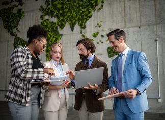 Diverse business team collaborating on global strategy. EU Inc. & Scaling cross-boarder teams