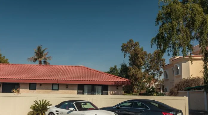 luxury cars parked near the house in the elite district of the city