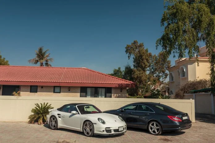 Dubai, United Arab Emirates. Luxury cars parked near the house in the elite district of the city luxury cars parked near the house in the elite district of the city