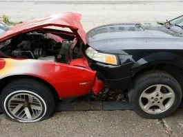 Cars are involved in a frontal collision.