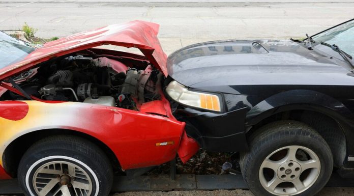 Cars are involved in a frontal collision.