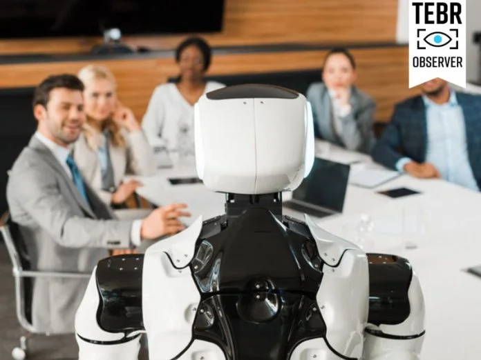 selective focus of multicultural businesspeople looking at AI robot in conference hall