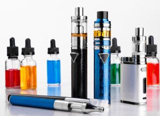 WHO’s Tobacco Warning to Europe Calls for Ambitious Reforms to Tackle Novel Products Modern electronic cigarettes, tobacco and bottles with assorted vape liquid on white background