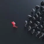 Group of colored businessman with one red leader.Trust in capability concept