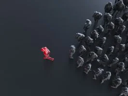 From Bottlenecks to Breakthroughs: The Business Case for Trust in Capability® Group of colored businessman with one red leader.Trust in capability concept