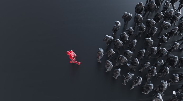 Group of colored businessman with one red leader.Trust in capability concept