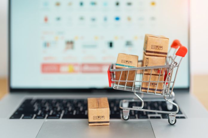 Boxes with shopping cart on a laptop computer. online shopping, Marketplace platform website, technology, ecommerce, shipping delivery, logistics and online payment concepts EU dropshipping