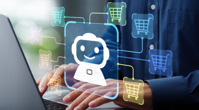 AI becomes customer. Man using laptop computer to give instructions to AI at desk.