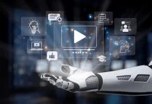AI Video Generation in 2026: The Year It Started Looking Like Real Creative Infrastructure A robot hand showcases various digital media icons, representing technology and innovation in artificial intelligence and communication, set in a modern, futuristic environment. AI Video Generation concept