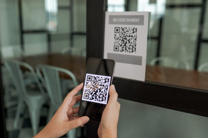 Qr code payment. E wallet. Man scanning tag accepted generate digital pay without money.scanning QR code online shopping cashless payment and verificationtechnology concept Link Page QR Code payment
