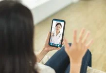 Two women communicating through a video chat on their smartphones, engaging in a real-time online conversation