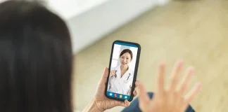 Two women communicating through a video chat on their smartphones, engaging in a real-time online conversation
