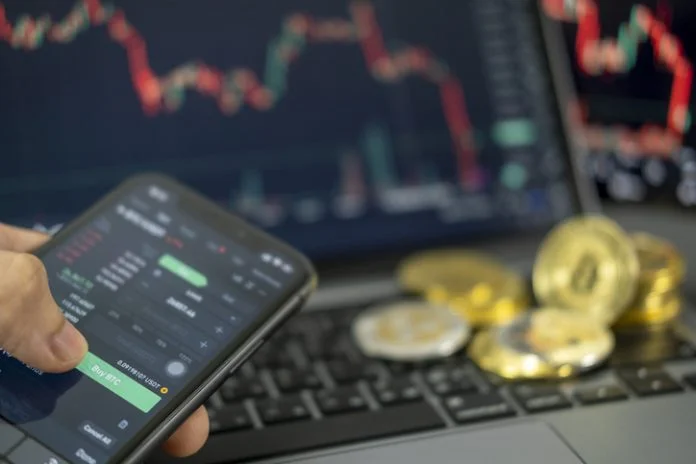 hand sell or buy a coin Cryptocurrency on smartphone. Bitcoin on chart background. Virtual cryptocurrency concept. digital for defi decentralized financial banking p2p exchange investment technology BTCC Exchange
