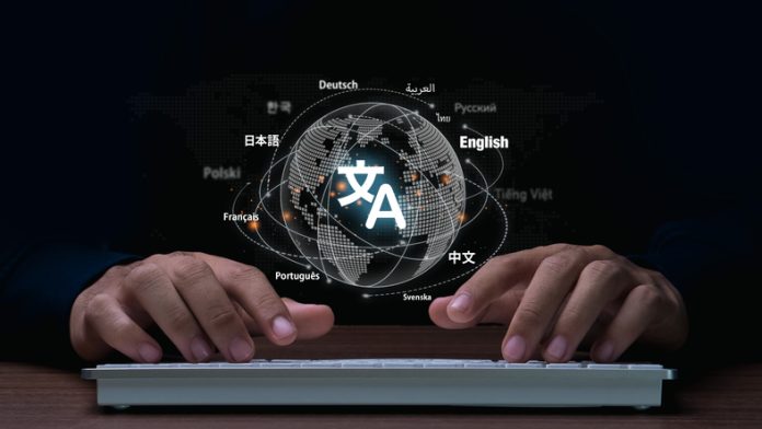 Man hand using keyboard to translation of foreign languages on website.Symbol of translation.Ai translator.Mobile app worldwide language conversation. Man hand using keyboard to translation of foreign languages on website.Symbol of translation.Ai translator.