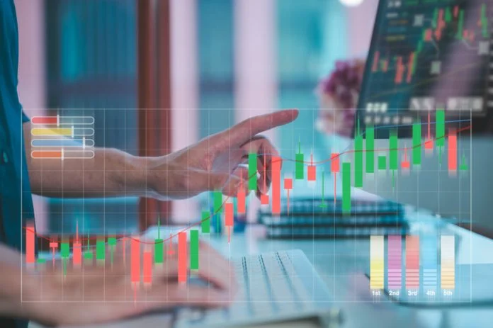 trading stock market, invesment concept, businessman working on computer laptop and virtual trading graph in office blurred background broker hidden fees