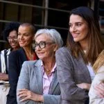 woman leaders, Graceful, smiling empowered diverse standing with arms crossed outdoor.