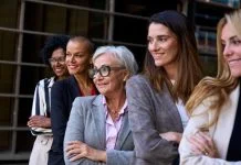 woman leaders, Graceful, smiling empowered diverse standing with arms crossed outdoor.