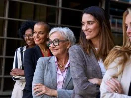 woman leaders, Graceful, smiling empowered diverse standing with arms crossed outdoor.