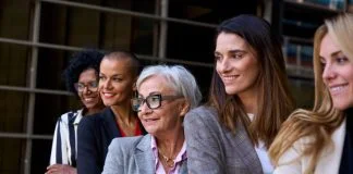 woman leaders, Graceful, smiling empowered diverse standing with arms crossed outdoor.