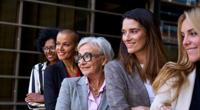 woman leaders, Graceful, smiling empowered diverse standing with arms crossed outdoor.