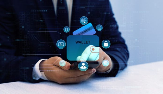 Bank manager using laptop to connect digital Wallet technology. Online banking, financial, smart technology and E-wallet. Business financial technology and development software with smart technology. Digital Identity Wallet