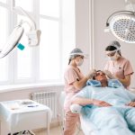 Discovering Turkey’s Best Hair Transplant Clinics Professional trichologist surgeons carry out hair FUE Sapphire method hair transplant surgery in operating room to male patient with hair loss problem.