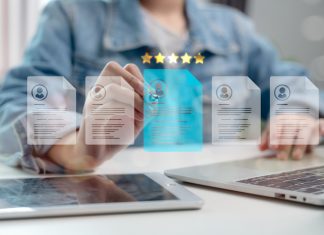 Human resource manager analyzing digital resumes with five-star rating system, selecting best candidate using AI technology and data-driven recruitment process.